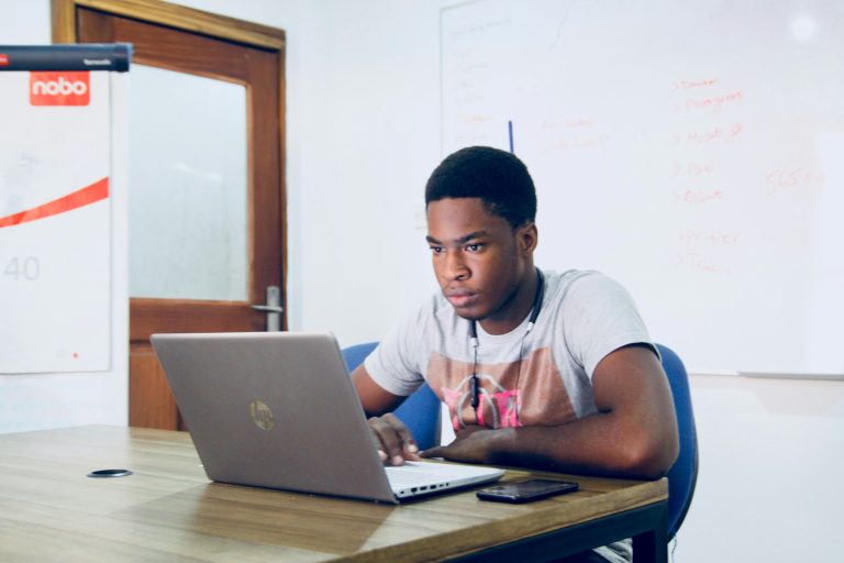Student using AI tools to study on a laptop